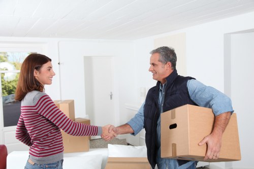 Office furniture and equipment being prepared for a local move