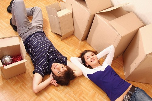 Packed moving boxes and furniture ready for collection in Plumstead